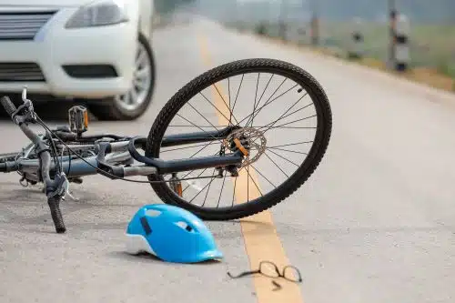 A car and a bicycle after an accident.