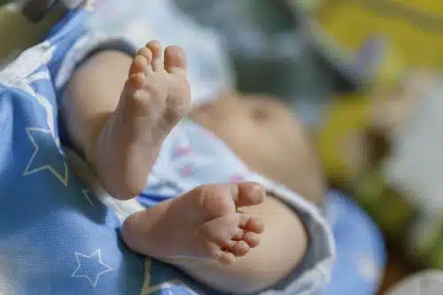 Close up of baby feet after birth in hospital.