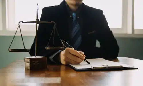 A dog bite lawyer working on a draft of a case for his client.