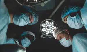 A patient's first-person perspective as a surgical team readies for an operation.