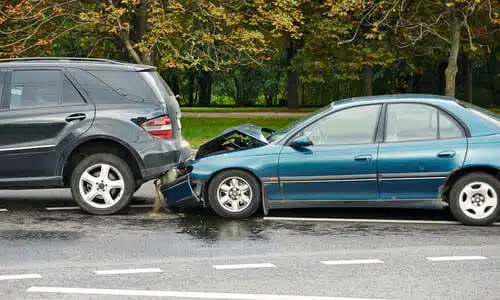A rear-ender collision between a drunk driver's blue car and an SUV.