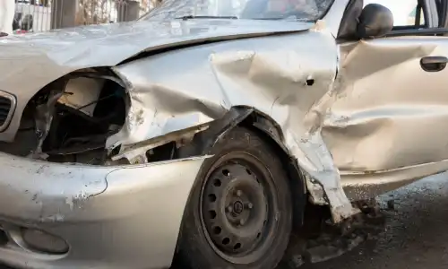 A crumpled front end of a car involved in a drunk driving accident on Staten Island.