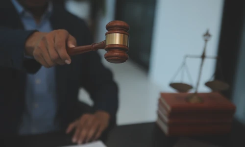 Close-up of a judge holding a gavel in court, symbolizing the legal process involved in the BioLab class action lawsuit.