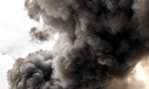 Heavy black smoke pouring into the air, representing the widespread environmental harm from the BioLab fire, now the focus of the BioLab class action lawsuit.