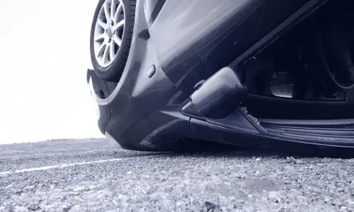 A close shot of an car door after the vehicle turned upside down in an accident.
