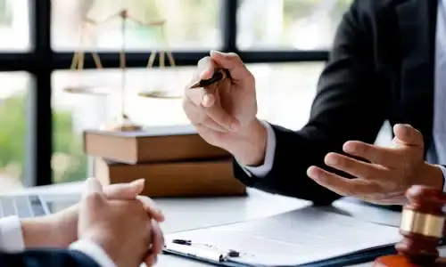 A wrongful death lawyer explaining the details of a case to a client.