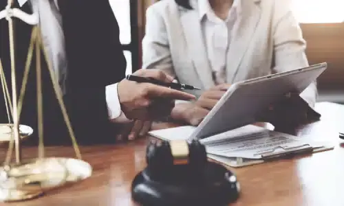 A lawyer presenting their approach to a personal injury claim to a client.