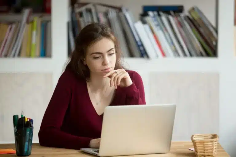 A woman is searching for a police report online. 