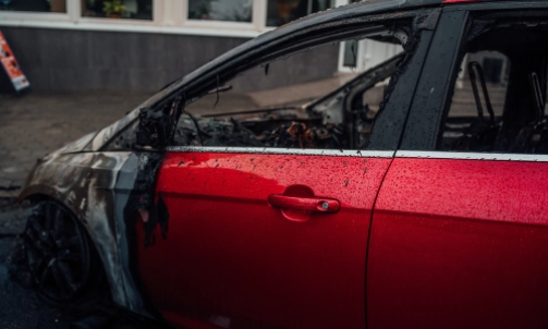 The driver's side door of a car that caught fire in an accident.
