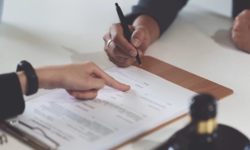 A personal injury lawyer assisting a client with a document they need to fill out.