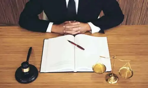 A slip and fall lawyer sitting at a desk, ready to meet with a client to discuss a case.