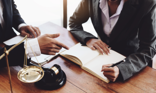 A team of personal injury lawyers in an office building a case for a client.