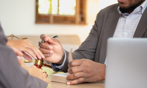 A lawyer explaining legal details to a client in need of help.
