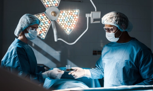 Surgeons in an operating room under bright surgical lights, symbolizing a medical procedure and potential medical malpractice scenario.