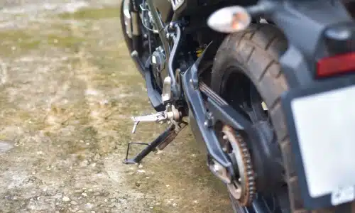 Close-up of a motorcycle rear wheel and chain, symbolizing cases for a Savannah motorcycle accident lawyer.