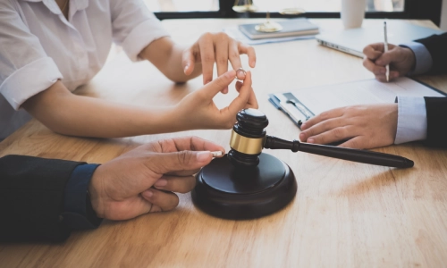 Photograph of Gainesville defective product lawyers reviewing evidence and discussing their client’s defective product case.