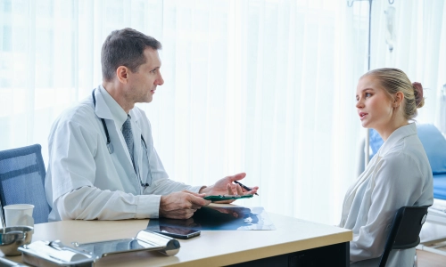 A medical malpractice lawyer serving clients throughout Houston consults with a doctor who is knowledgeable about medical conditions similar to his client’s case.