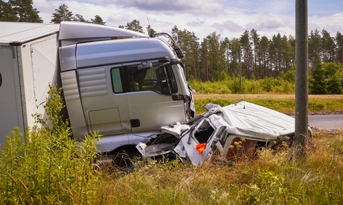 A photo of truck collided with another vehicle, resulting in extensive damage.