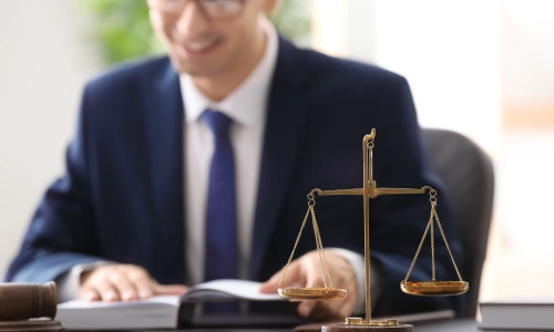 A Tempe distracted driving lawyer happily working on a client's case.