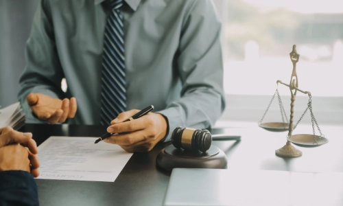 A Tempe Lyft accident lawyer explaining details of a Lyft crash case to a client.