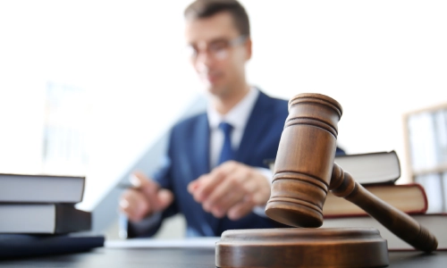 A depth-of-field shot of a Tempe medical malpractice lawyer with a gavel in the foreground.
