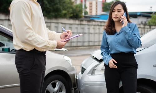 A woman who was involved in a car accident is calling a Tucson car accident lawyer before giving a statement to an insurance agent.