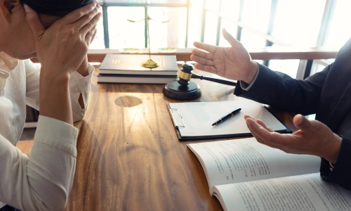 A frustrated client describing her experience of buying a damaged product during a consultation with a Tucson defective product lawyer.