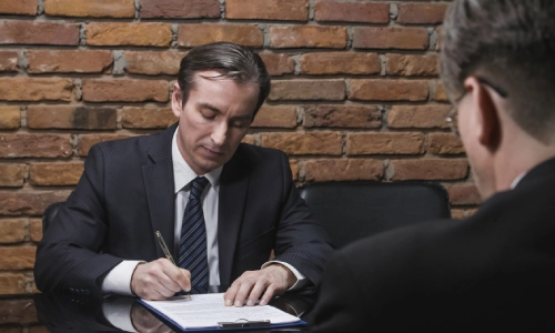 A Tucson wrongful death lawyer interviews a family member with regard to a wrongful death case.