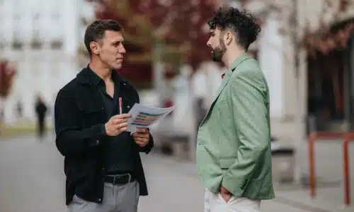 A pedestrian accident lawyer serving Bronx interviews a potential witness to gather information about the accident case.