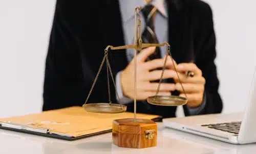 A pedestrian accident lawyer serving Long Island is in an online meeting on a laptop discussing case details