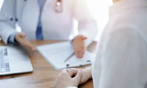 A medical malpractice lawyer serving Manhattan speaks with a doctor to discuss medical evidence and seek professional insight for a case.