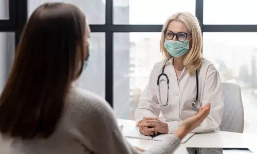 A brain injury lawyer serving Queens consults with a medical professional to discuss a client's traumatic brain injury case.